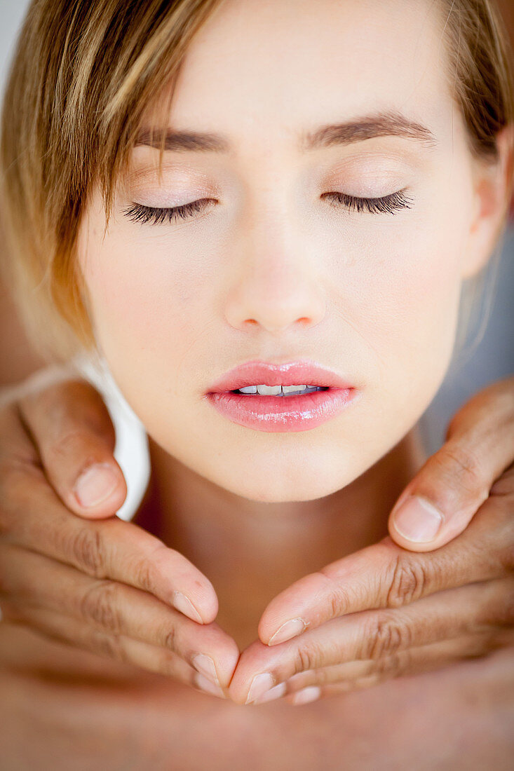 Woman receiving reiki treatment