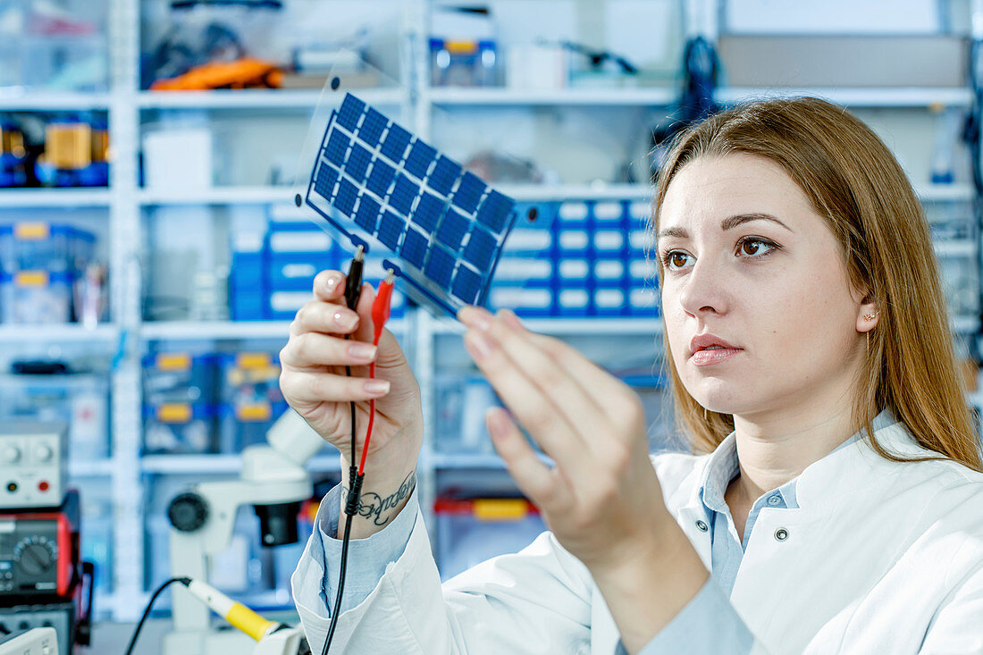 Girl holding film solar cells