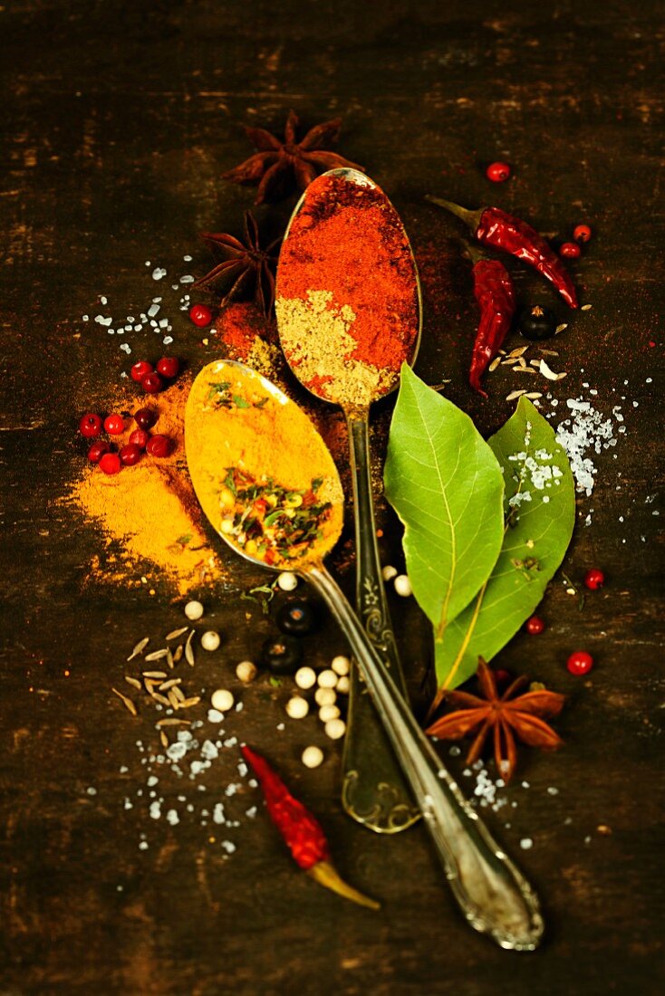 Bright spices on an old wooden board
