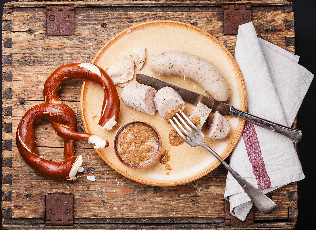 Bavarian snack with weisswurst white sausages and pretzel