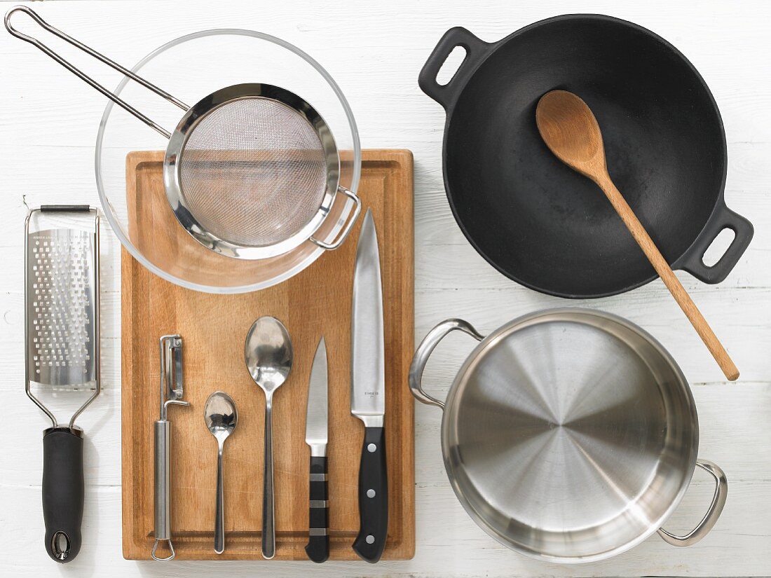 Cooking utensils for making a chicken wok dish with vegetables