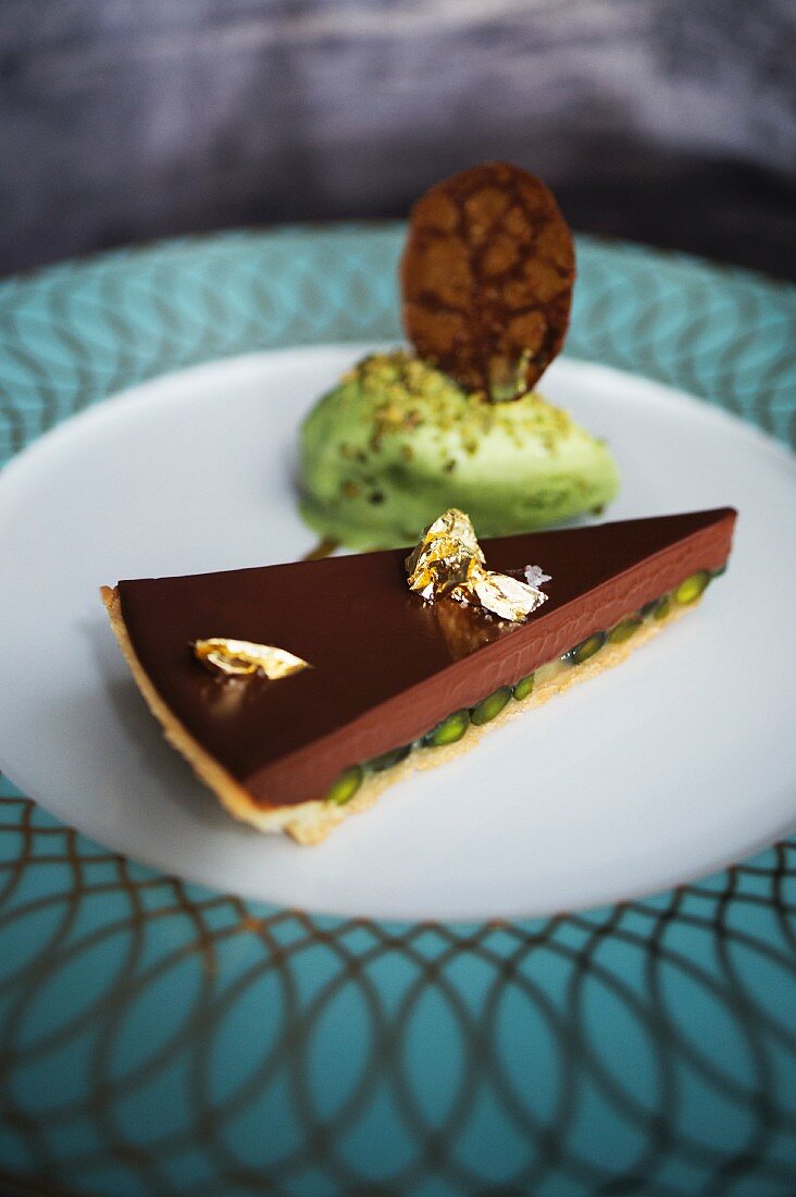 Manjari chocolate tart with muscovado sugar and pistachio ice cream served at 'Jacobs Restaurant' in Hamburg, Germany