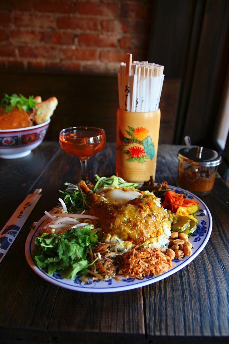 Nasi lemak (chicken curry, coconut rice, sambal ikan bilis, slow poached egg)