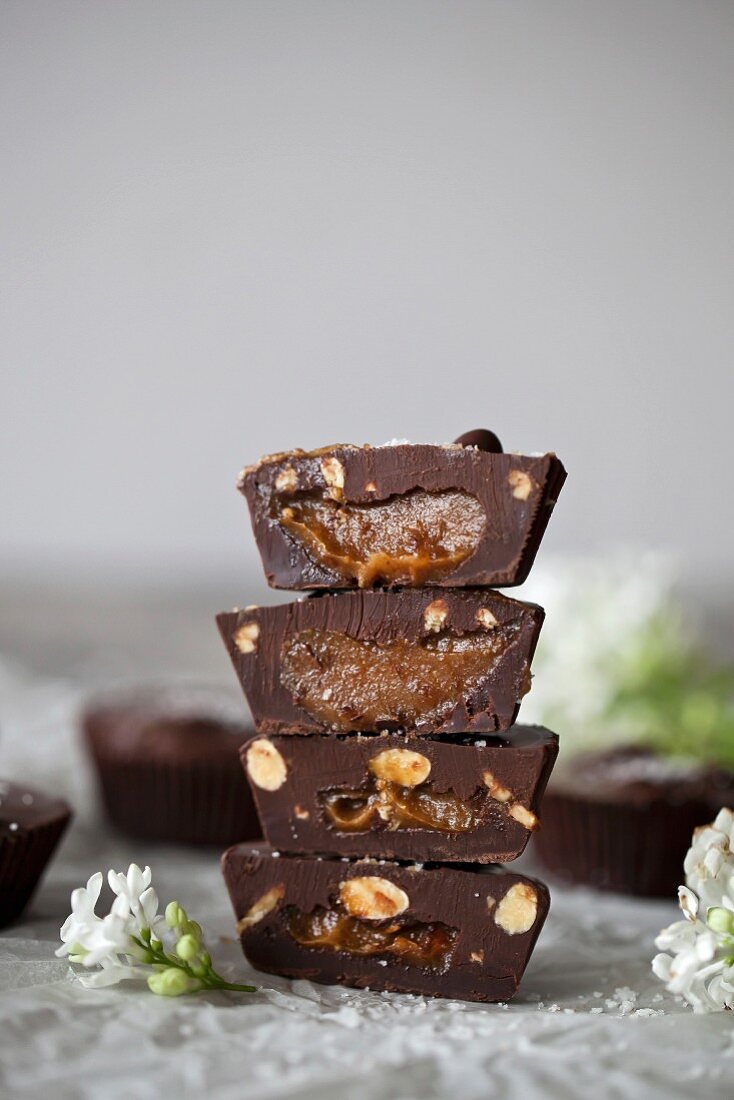 Stack of Chocolate cups filled with date caramel