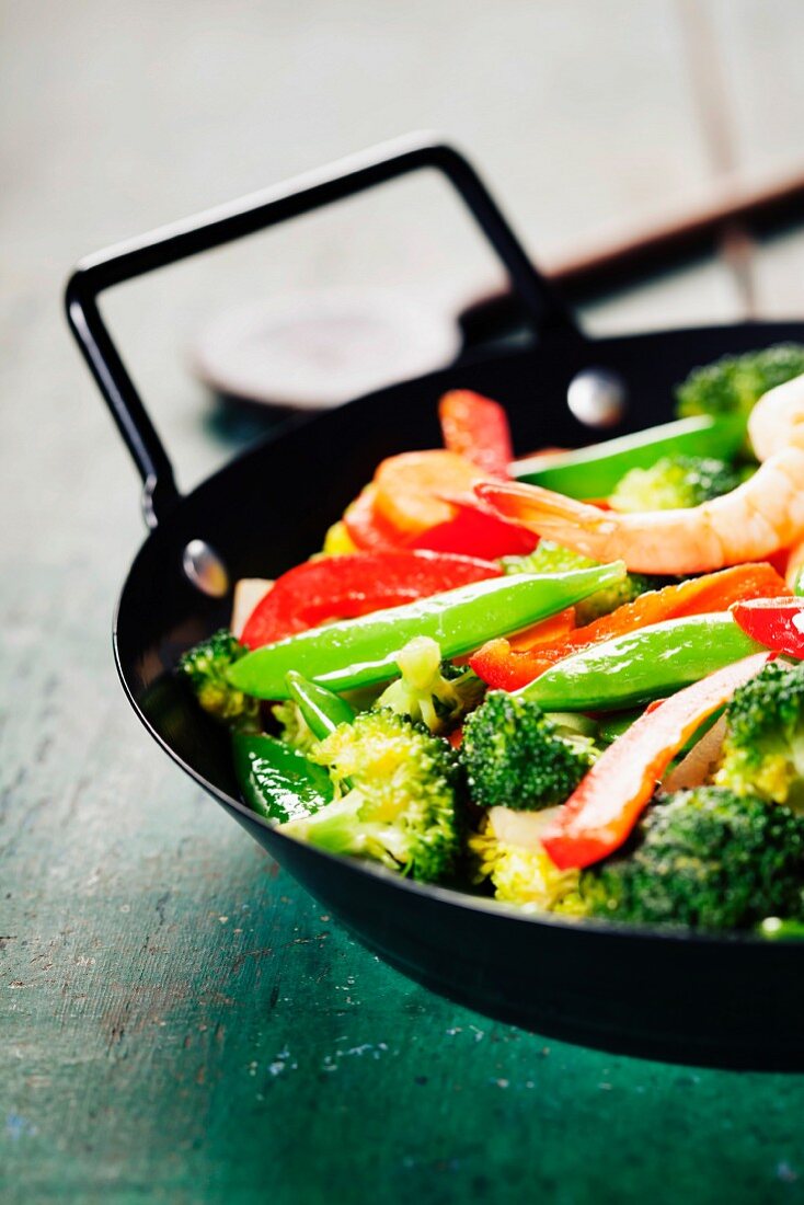 Fresh vegetables and shrimps on pan