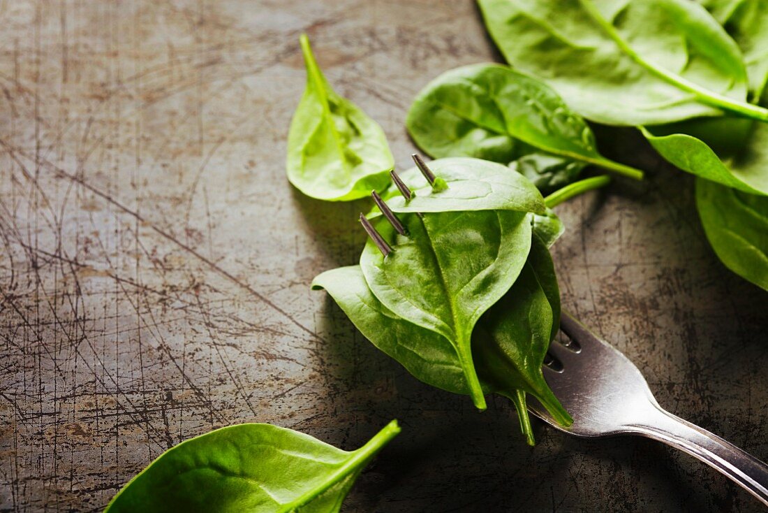 Spinach leaves on a fork