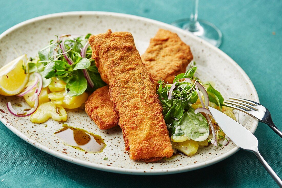 Baked carp with potato and lamb's lettuce