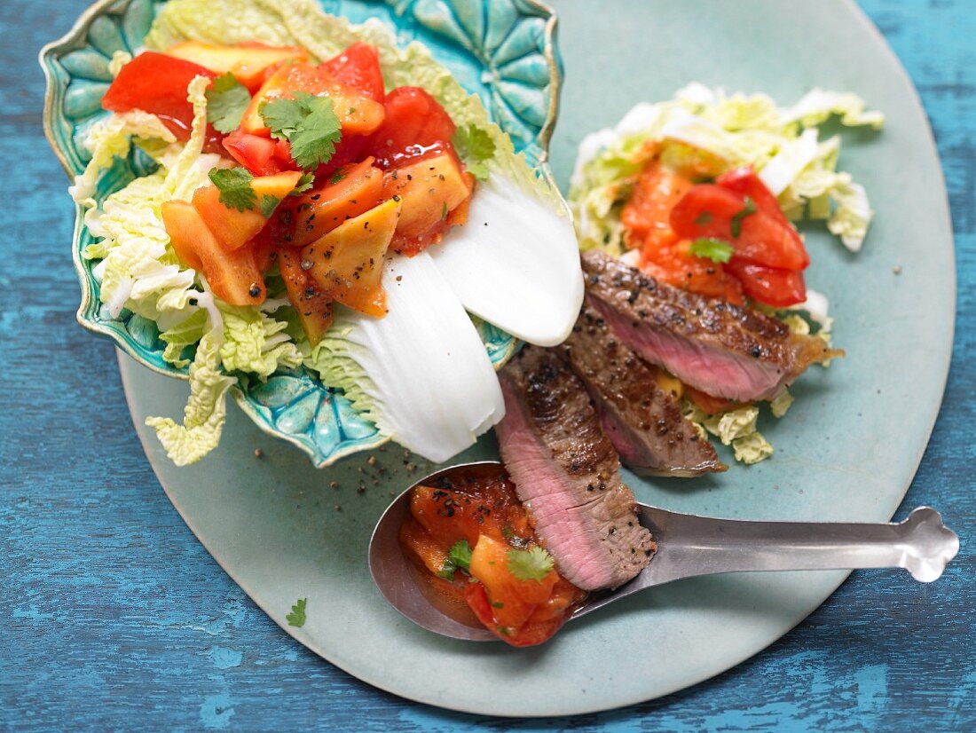 A spicy steak salad with Chinese cabbage and papaya