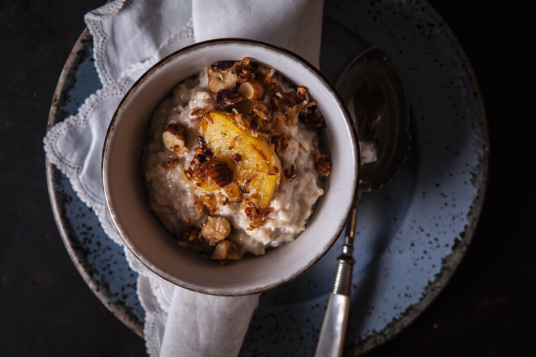 Porridge with apples, caramelised hazelnuts and coconut flakes