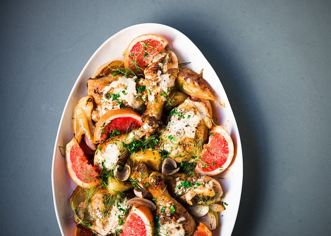 Braised chicken pieces with pink grapefruit and fennel