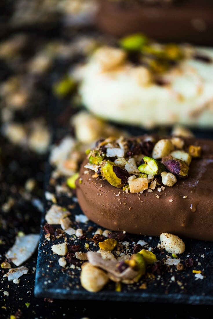 A chocolate ice lolly with dukkah (a nut and spice mix)