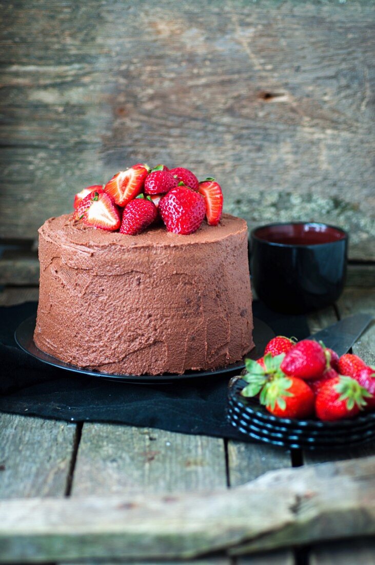 A chocolate cake with strawberries