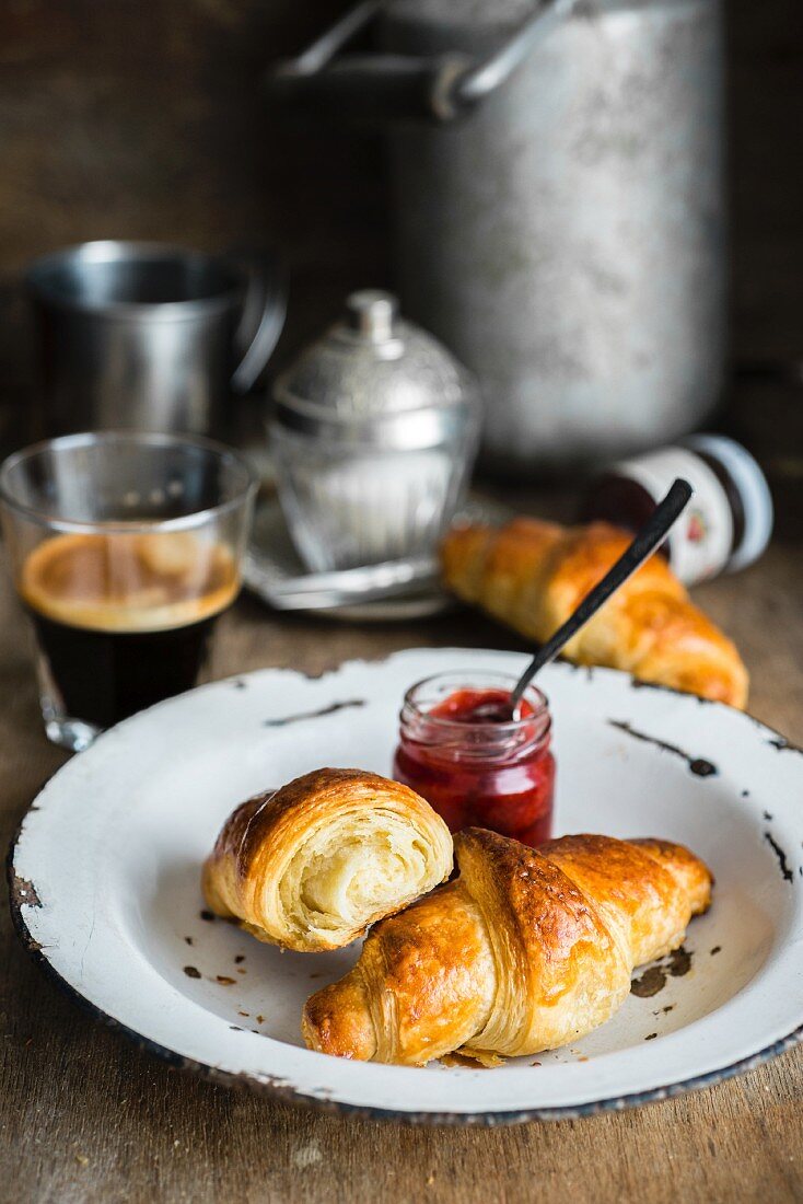 Homemade croissants with jam and coffee