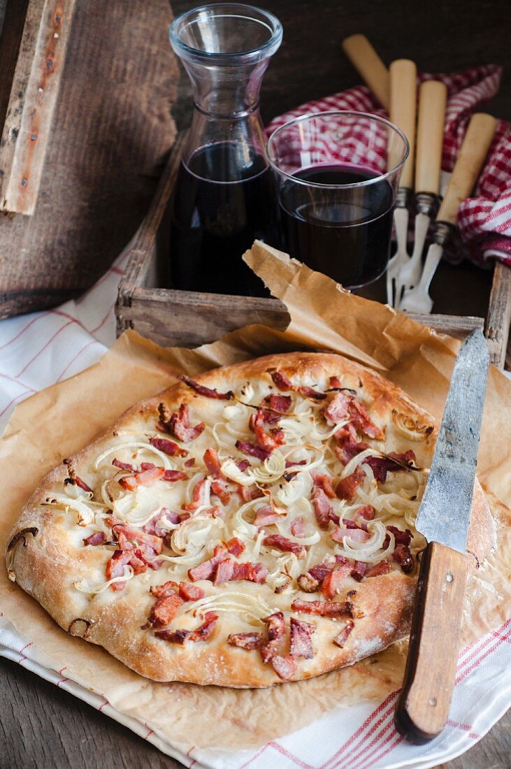 Rustic pizza with bacon and onion