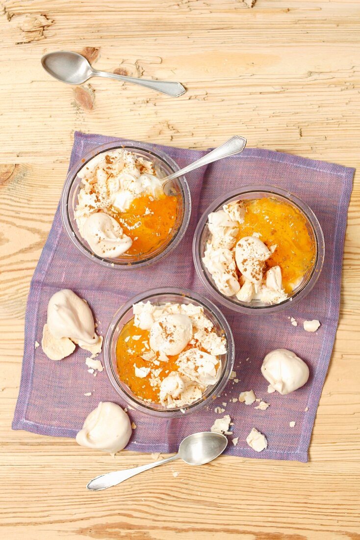 Yogurt and apricot jam dessert with meringues