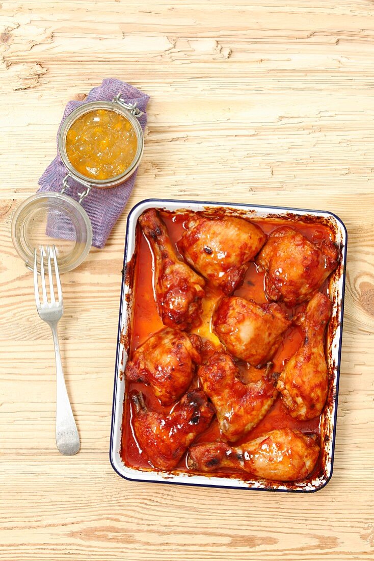 Chicken wings, thighs and drumsticks with barbecue sauce and apricot glaze