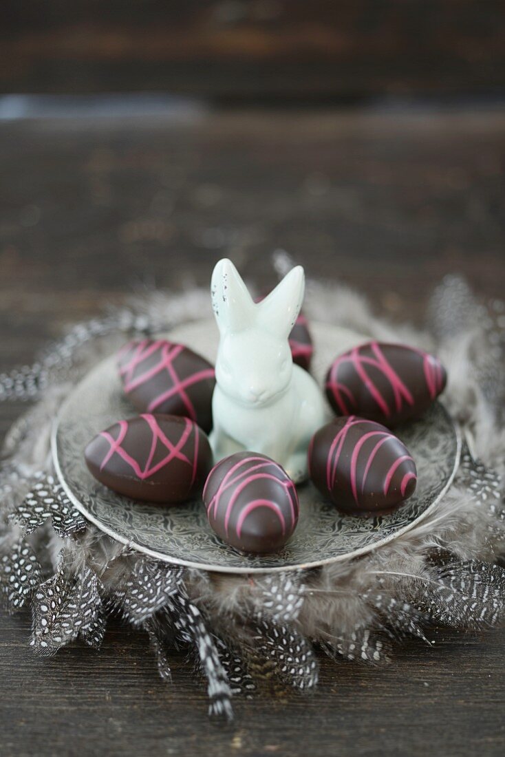 Chocolate easter eggs and a porcelain rabbit