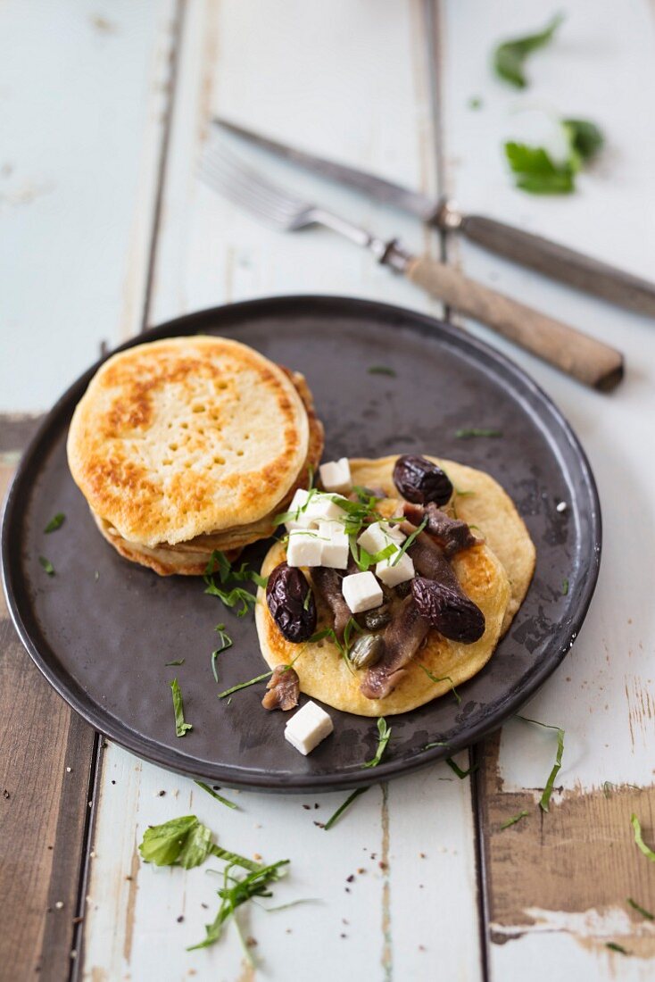 Blinis with feta and olives