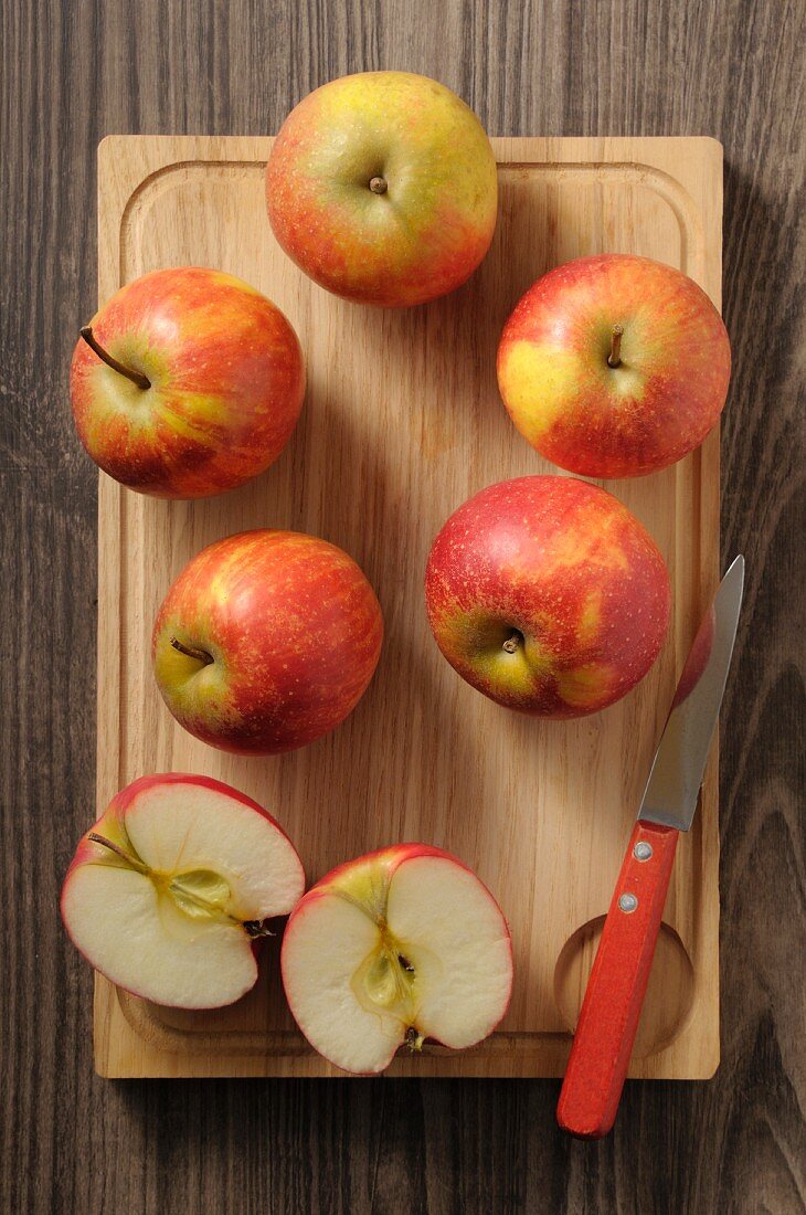 Fresh Rubinette apples on a chopping board