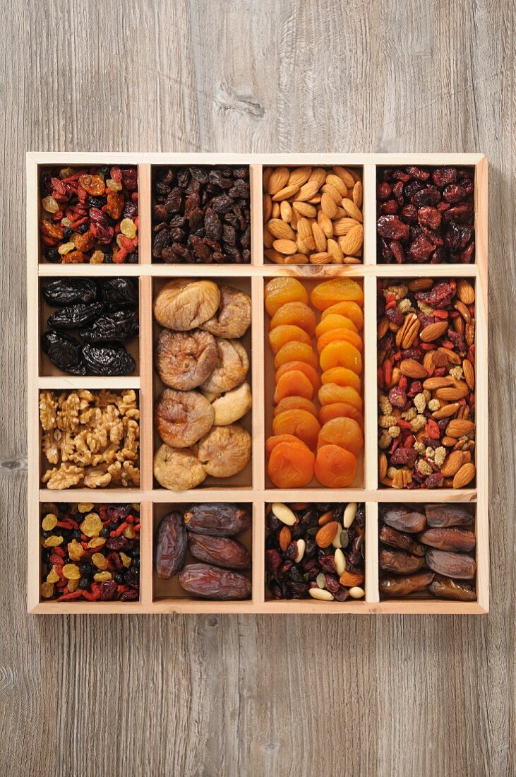 Various dried fruit and nuts in a case