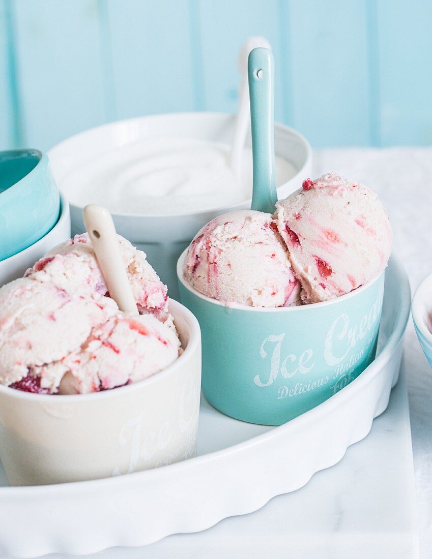 Yogurt, banana and strawberry ice cream in ice cream cups