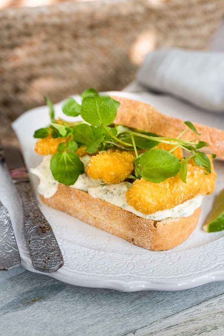 A fish finger sandwich and tartare sauce