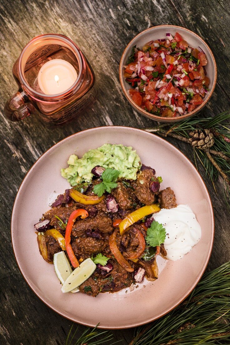 Chilli con carne with beef brisket, sour cream, guacamole and salsa