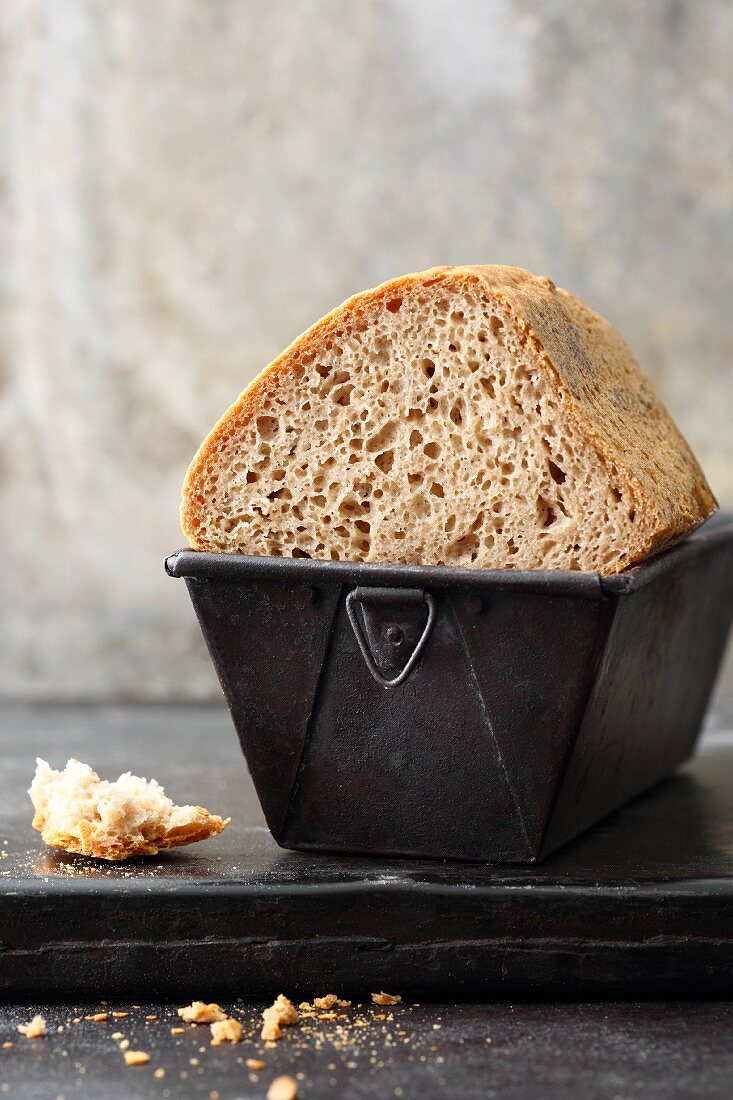 Gluten-free rye and wheat bread in a baking tin