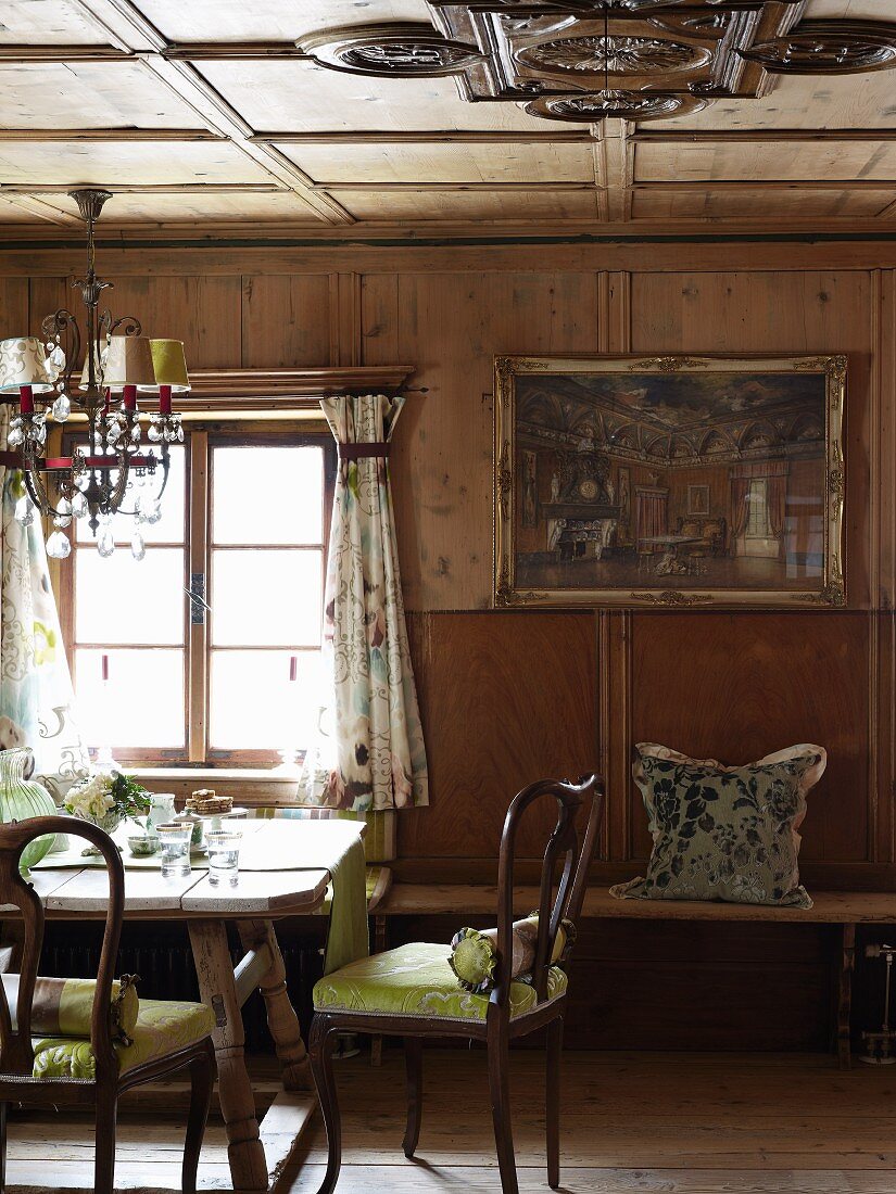 Antique furniture in wood-panelled parlour