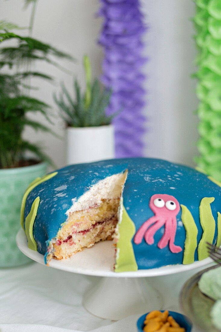 Coconut cream cake with a squid decoration for a maritime themed party