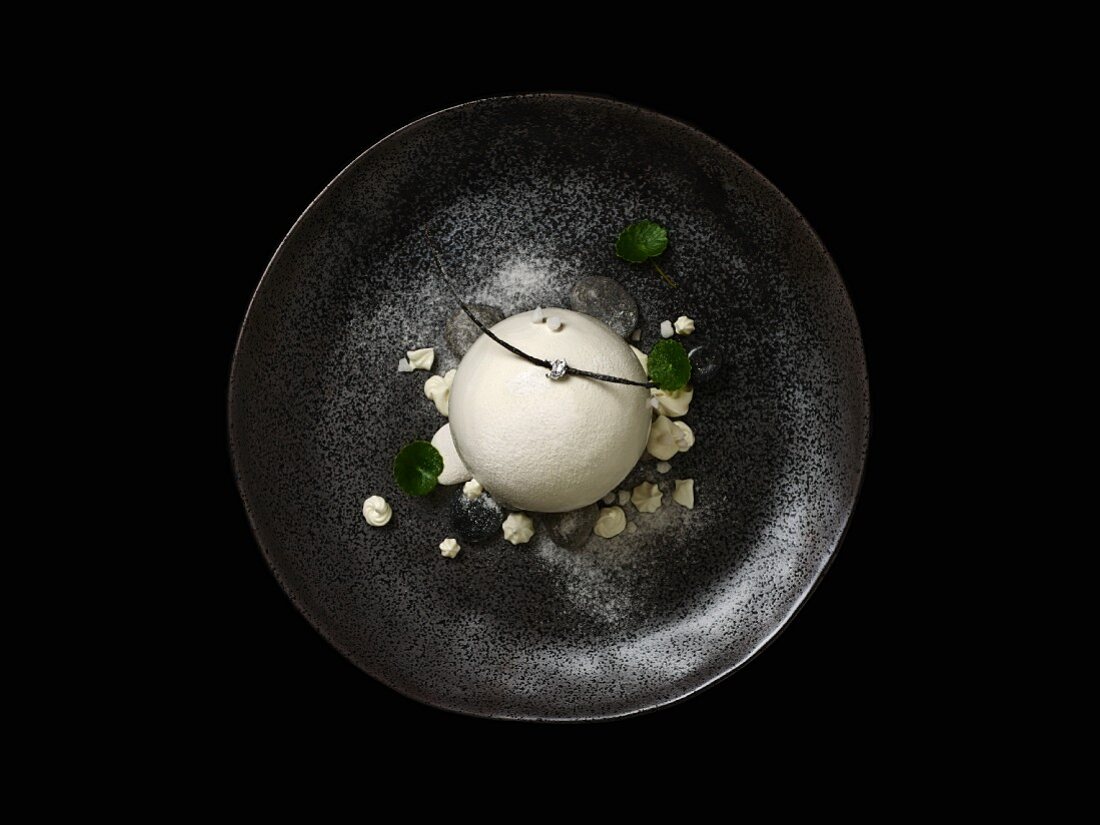 Fine dining pond in the forest white chocolate sphere