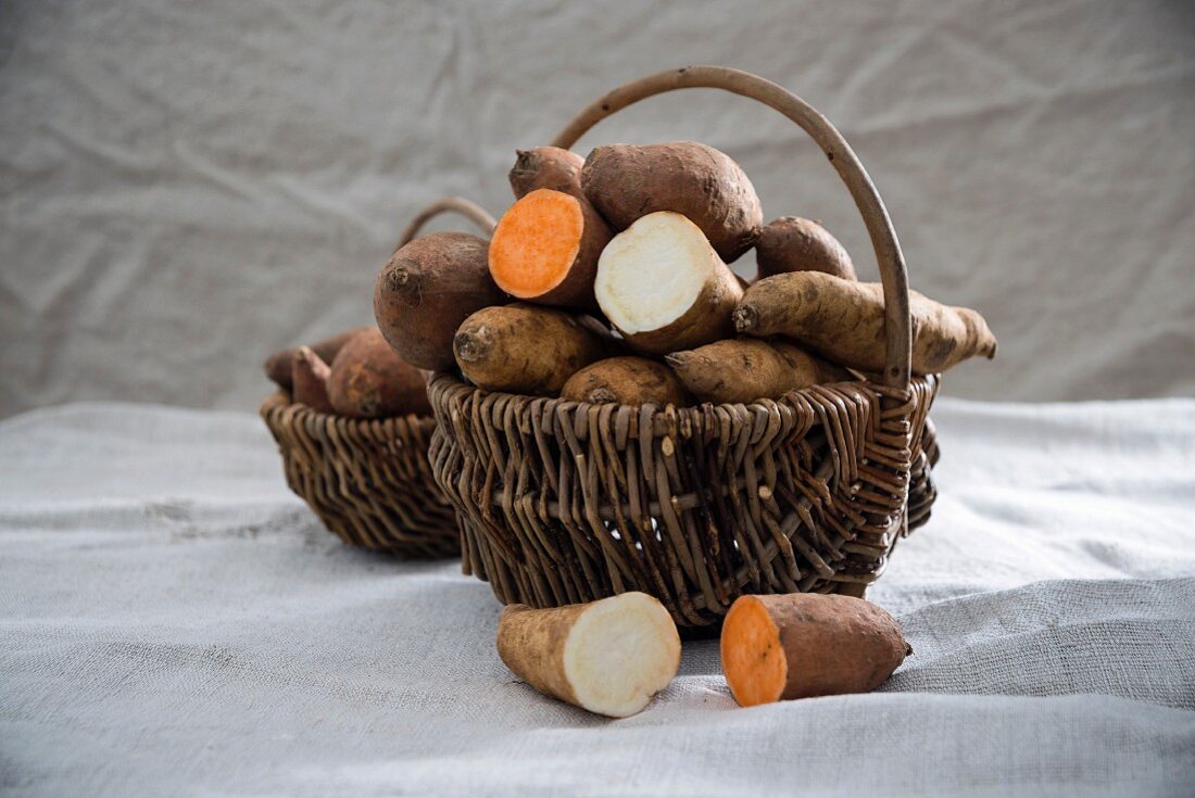 White and red sweet potatoes in a basket