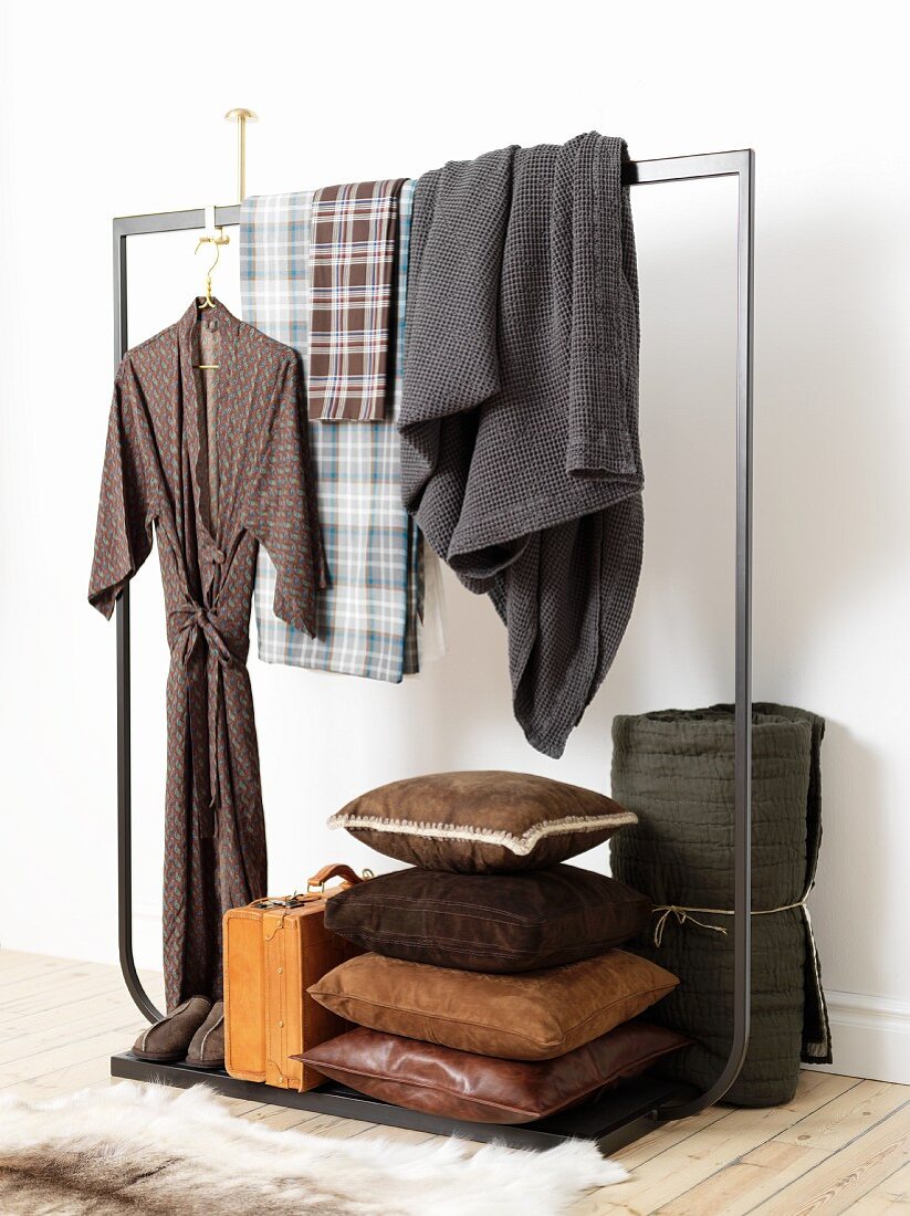 Dressing grown, blankets, leather cushions and briefcase