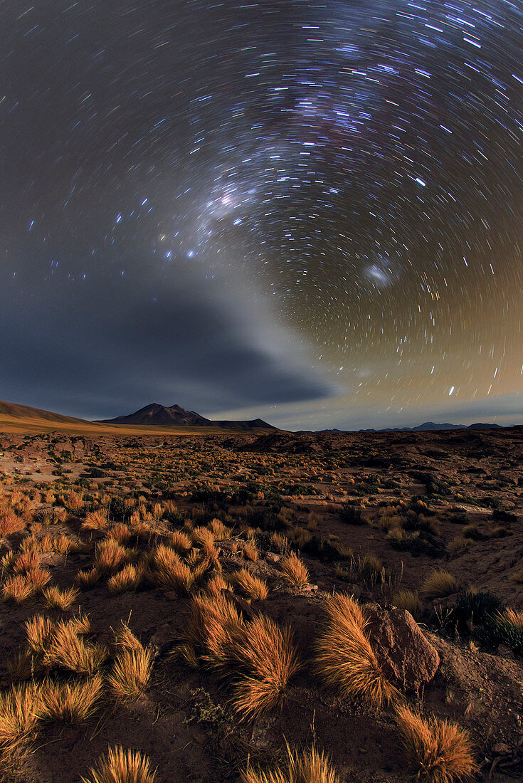 Clouds and star trails over the Atacama Desert