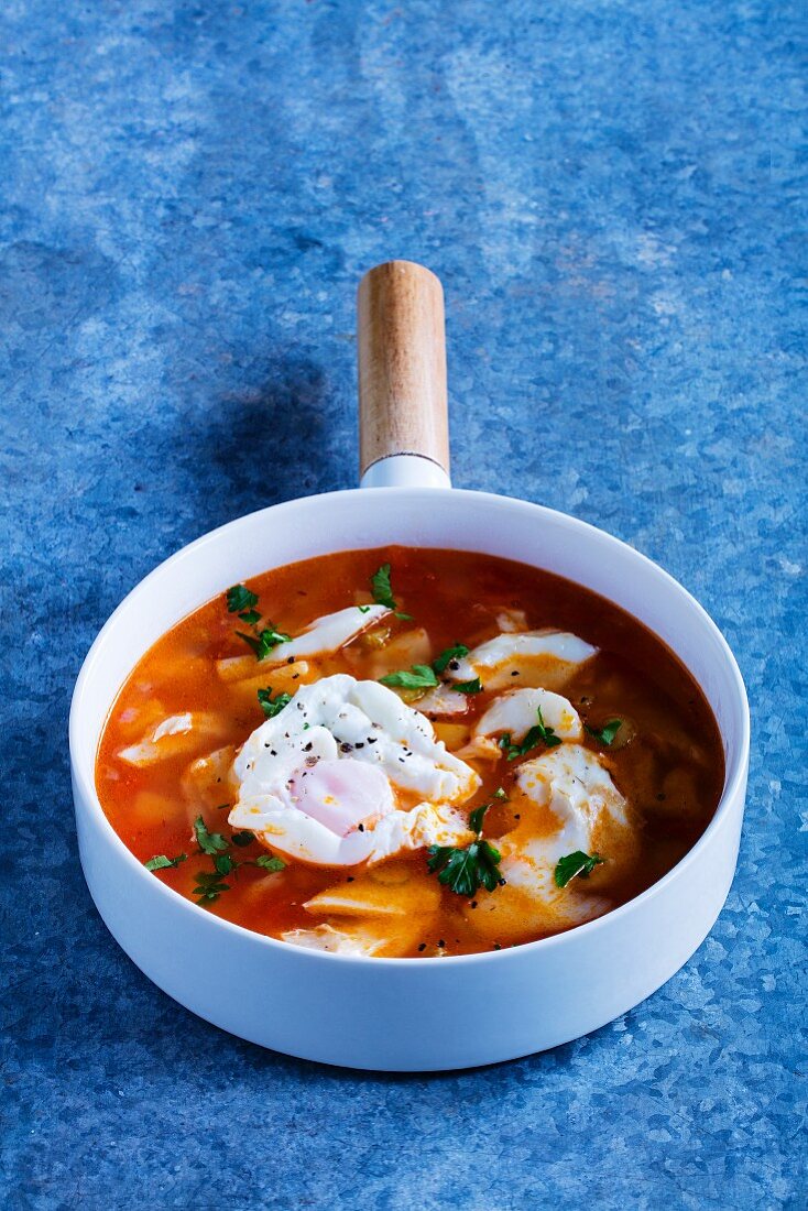 Cod soup with poached eggs
