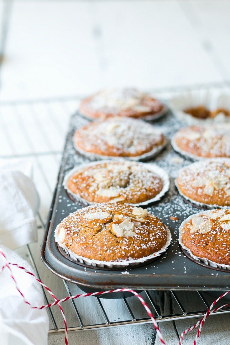 Almond muffins in a muffin tin