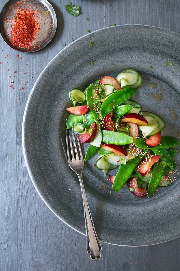 Sugar snap salad with plums