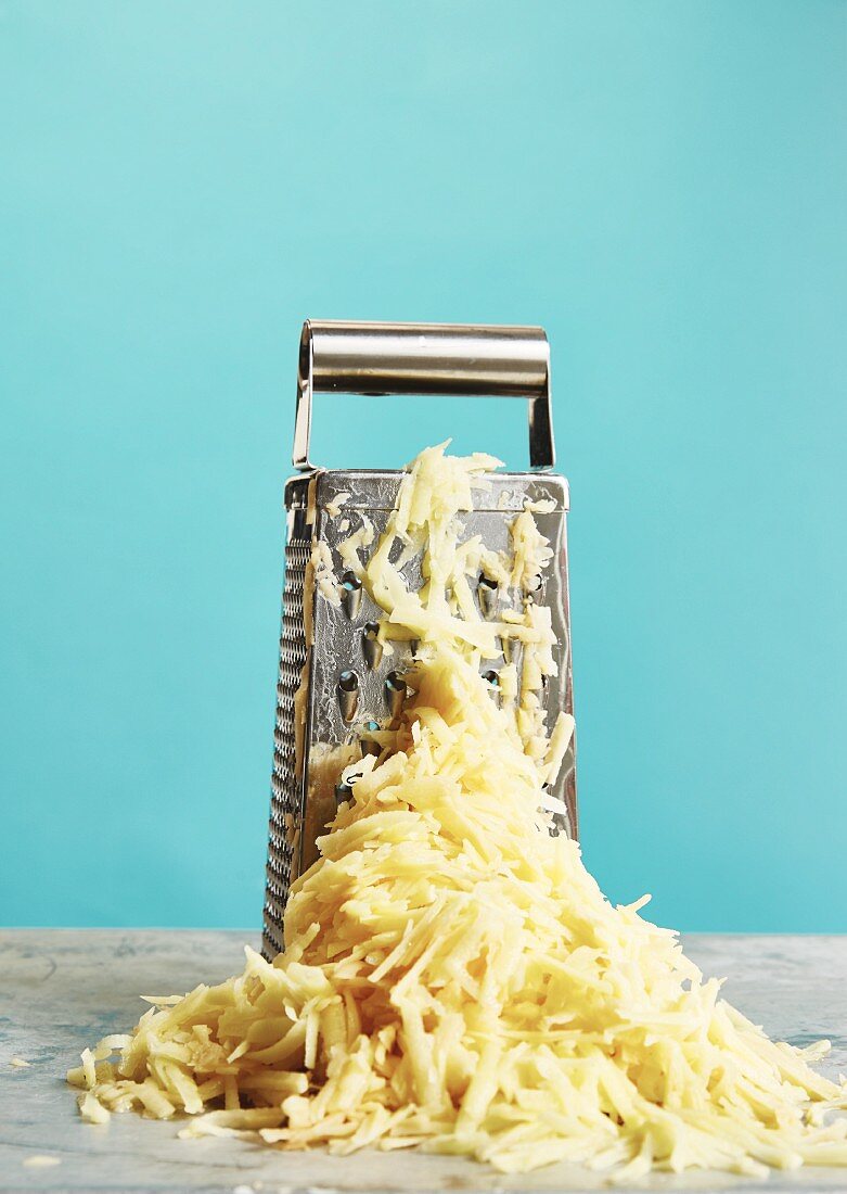 A grater with grated potato