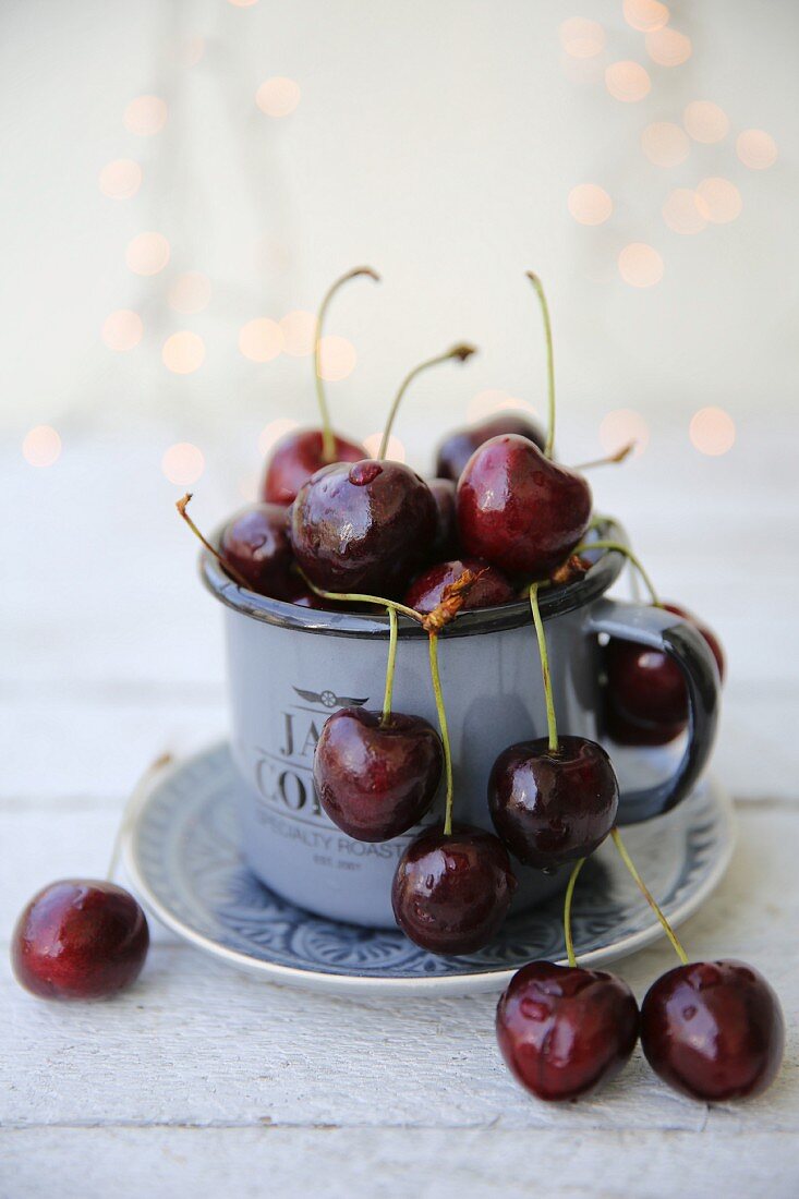 Cherries in an enamel mug