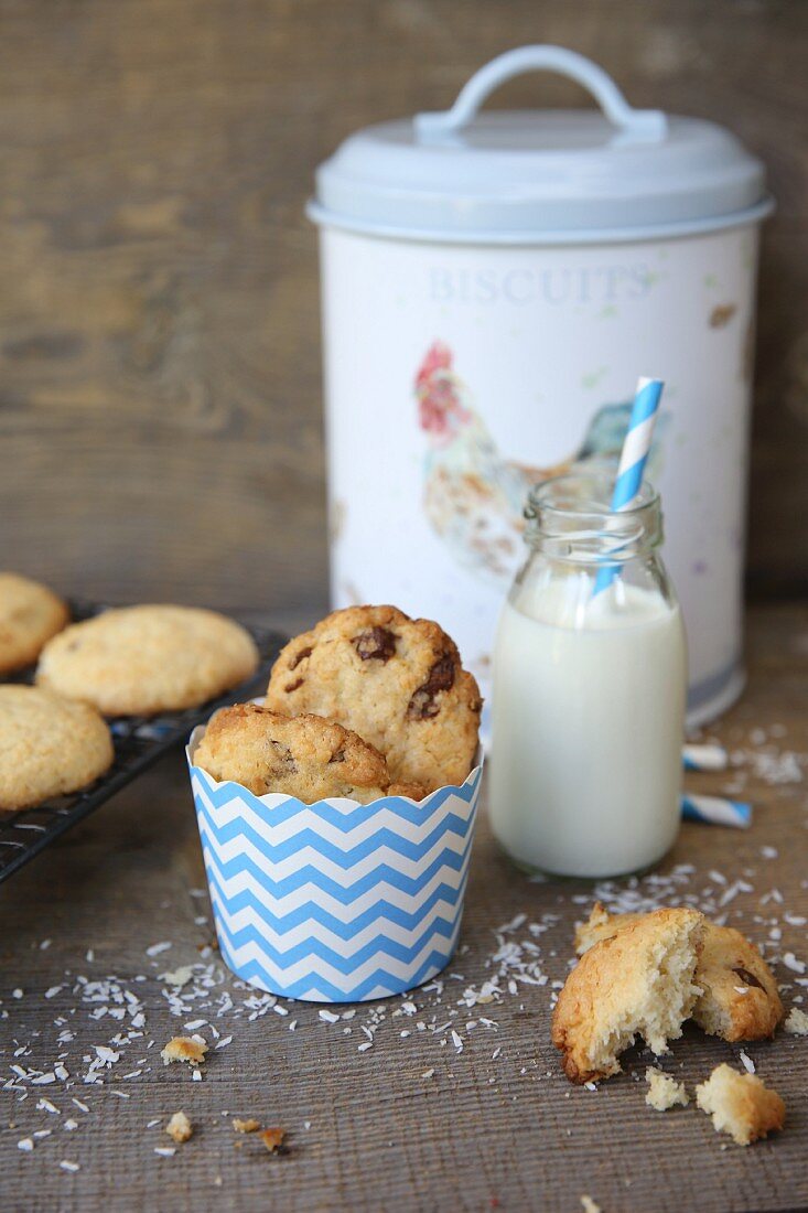 Coconut cookies with chocolate chip and a bottle of milk