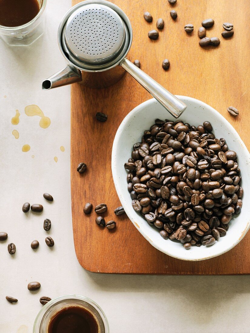 Coffee beans and an espresso jug
