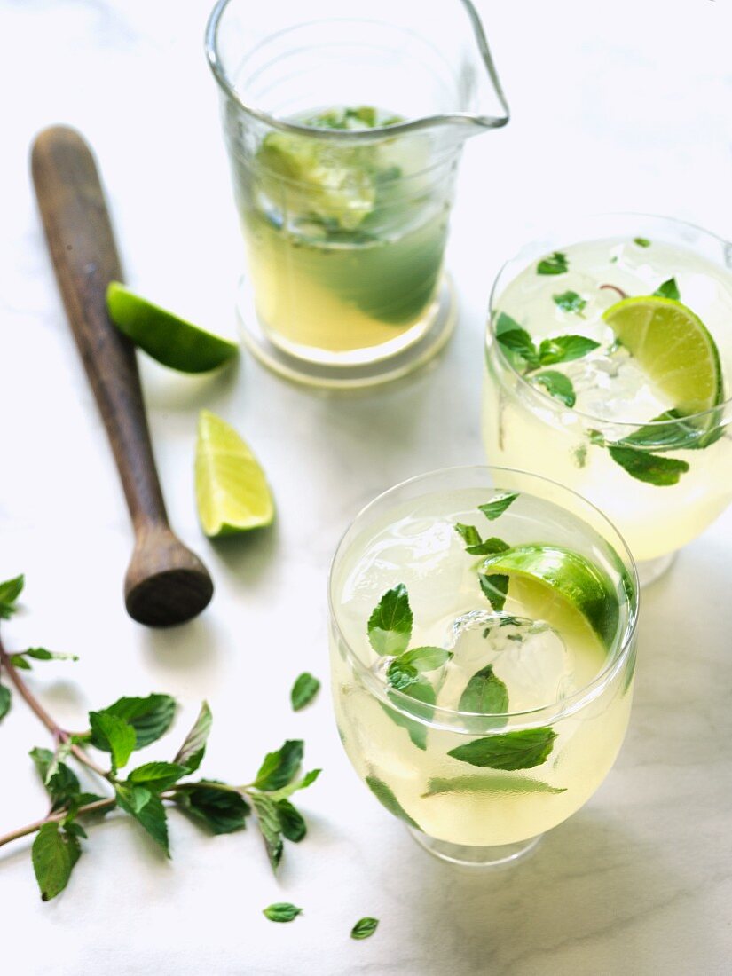 Mojitos with lime, mint and ice cubes