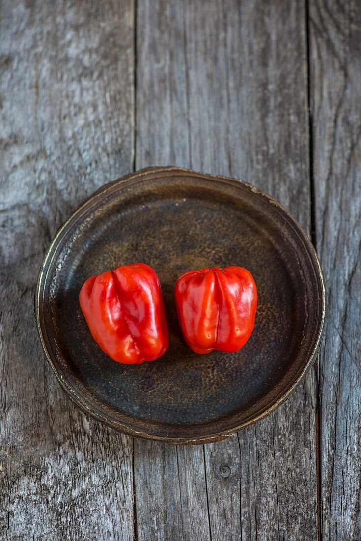 Two Habanero chillies on a plate