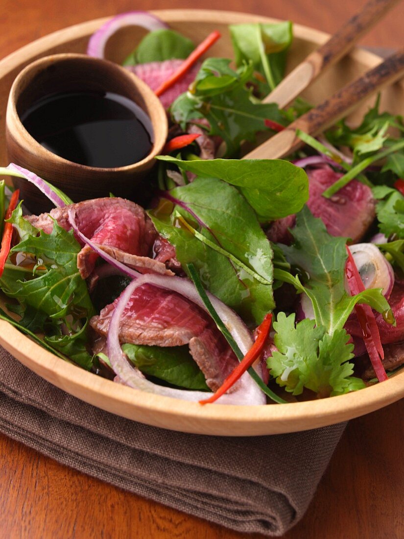 A bowl of thai beef salad