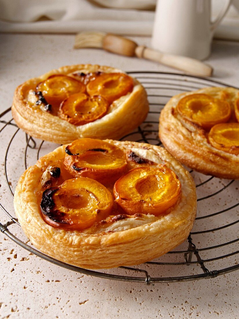 Apricot galettes on a wire cooling rack