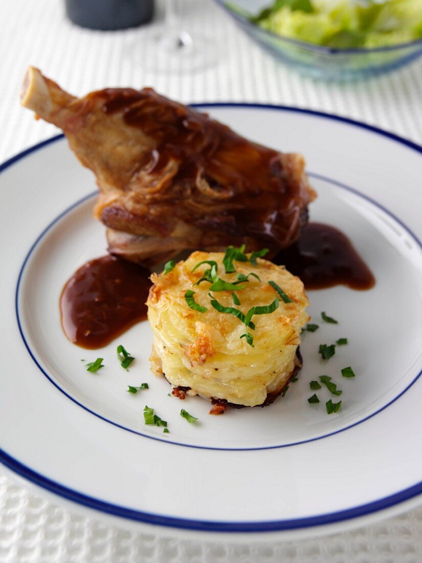 Lamb shank with potato tower editorial food