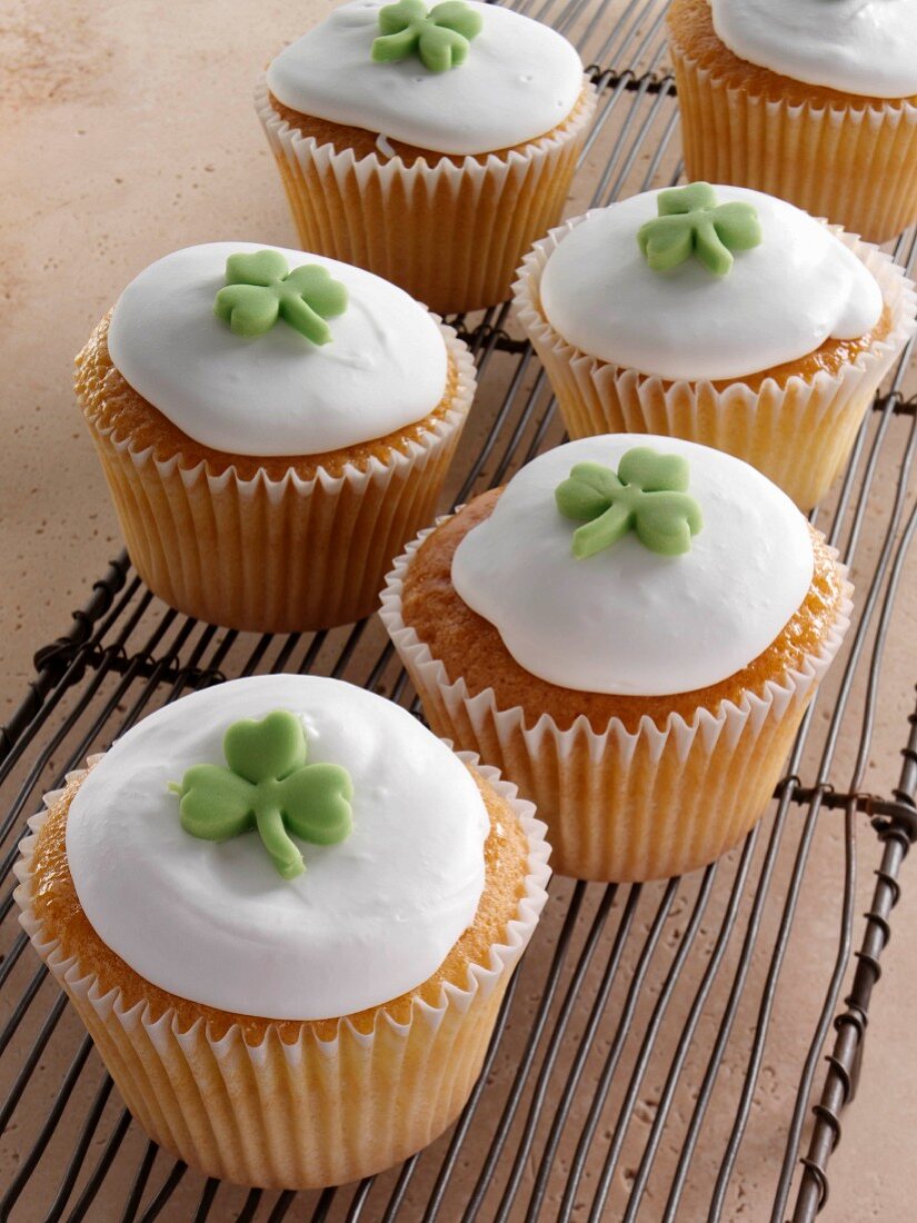 Cupcakes with a green shamrock on top of the white icing