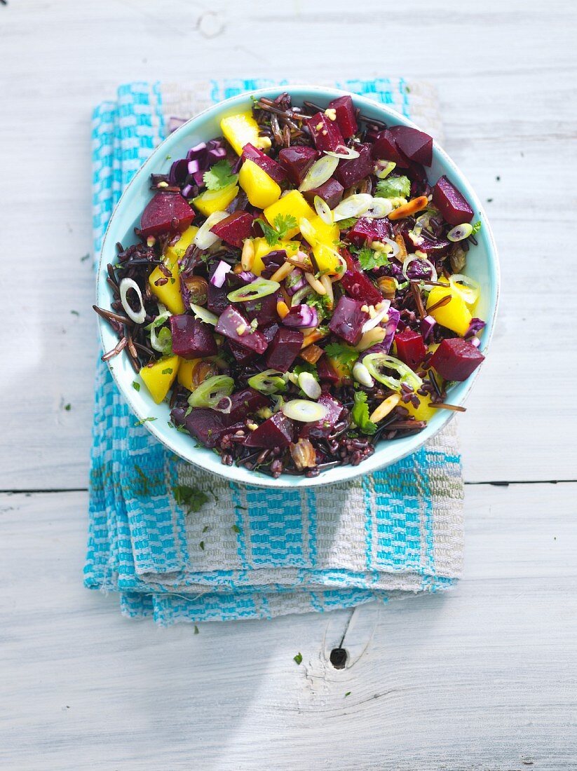 Black rice salad with beetroot and spring onions