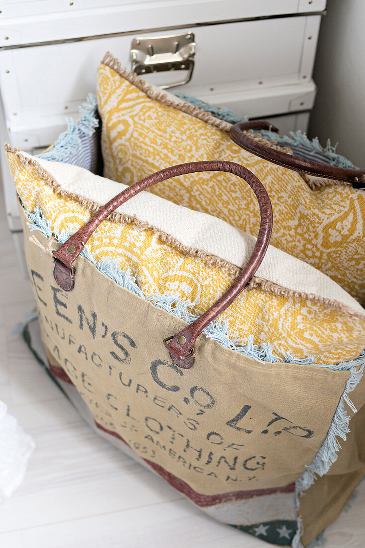 Yellow patterned cushion in bag