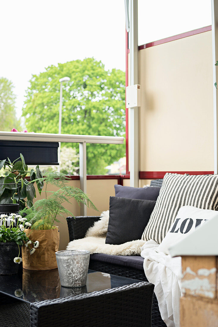 Black furniture on small cosy balcony